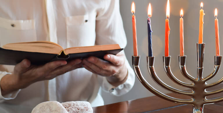 Person reading a Jewish prayer book